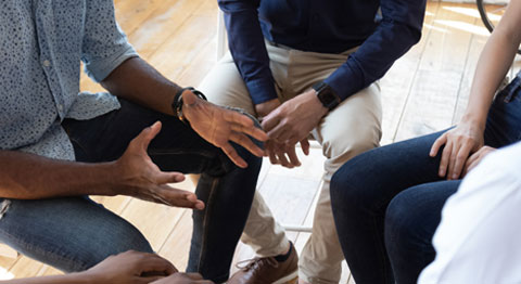 A group of people in therapy