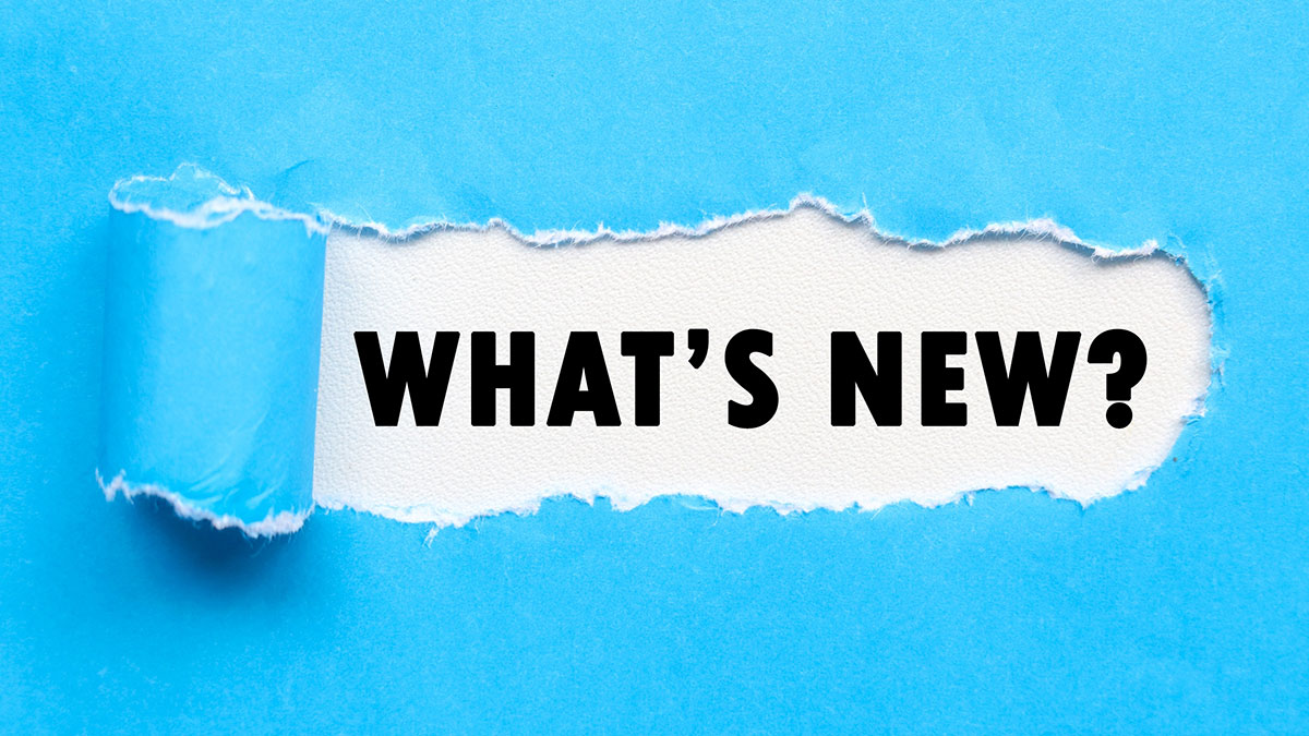 Blue paper torn in the center to reveal the words: "What's New?"