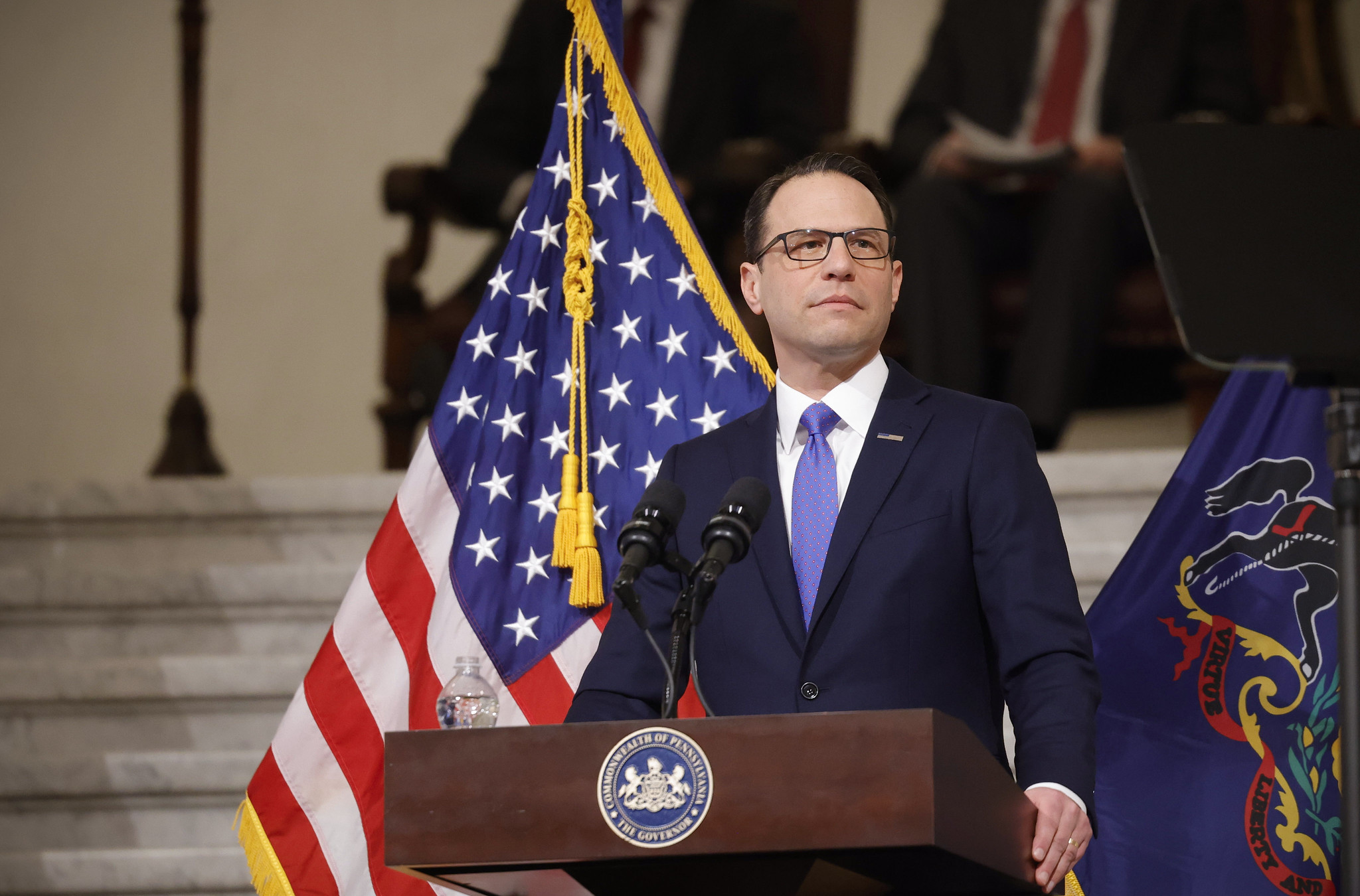 Governor Josh Shapiro standing at a podium