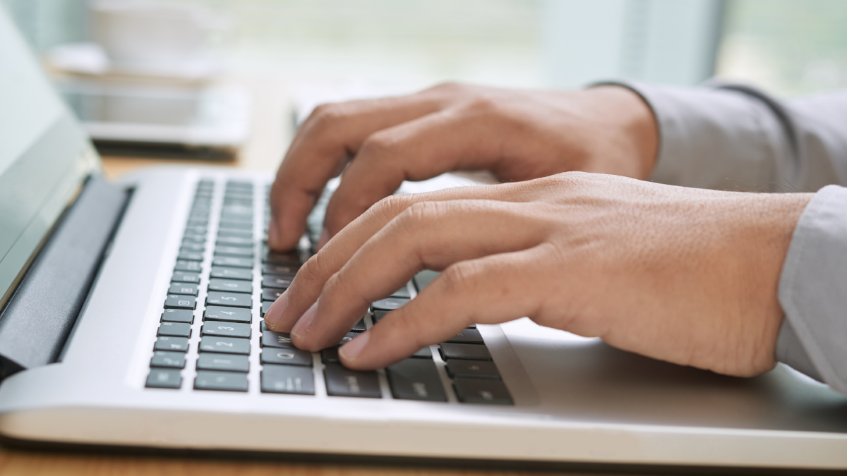 Person typing on a laptop